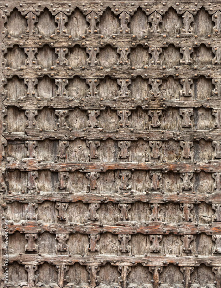Wooden door of Sant'Anastasia Church in Verona, Italy.