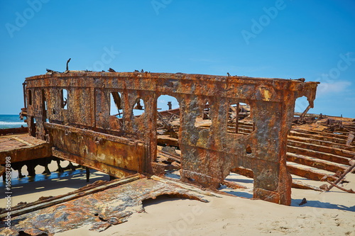 Rusty shipwreck on tropical beach the maheno fraser island queen