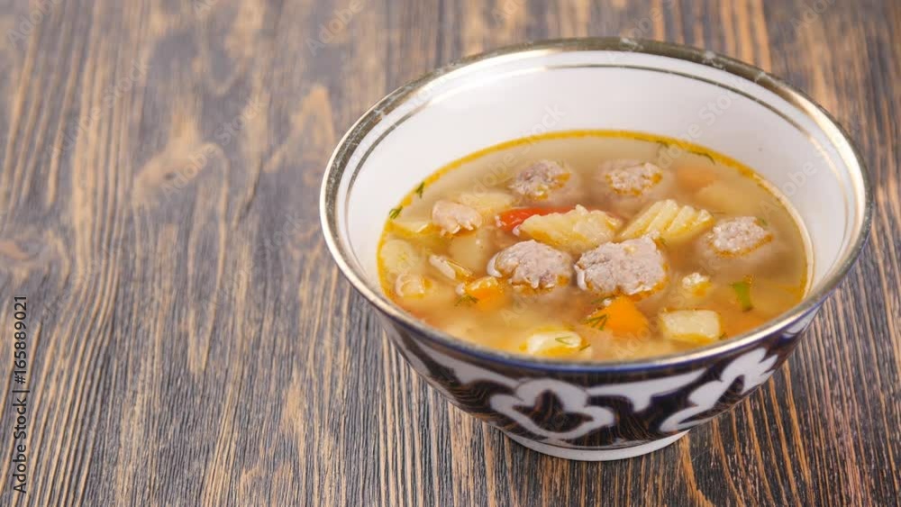 uzbek soup on wooden table uzbek soup on wooden table