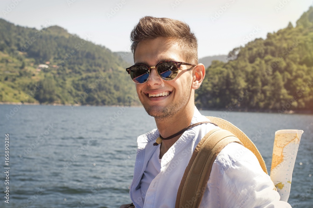 Fototapeta premium traveler with backpack and map