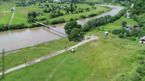 aerial view agriculture field and mountains. summer day. Summer day landscape.  Flying over the beautiful rural landscape. Aerial camera shot. 