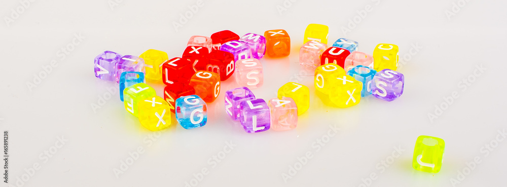  alphabet printed on the shape eraser for learning purposes. Copy space for text and logo.