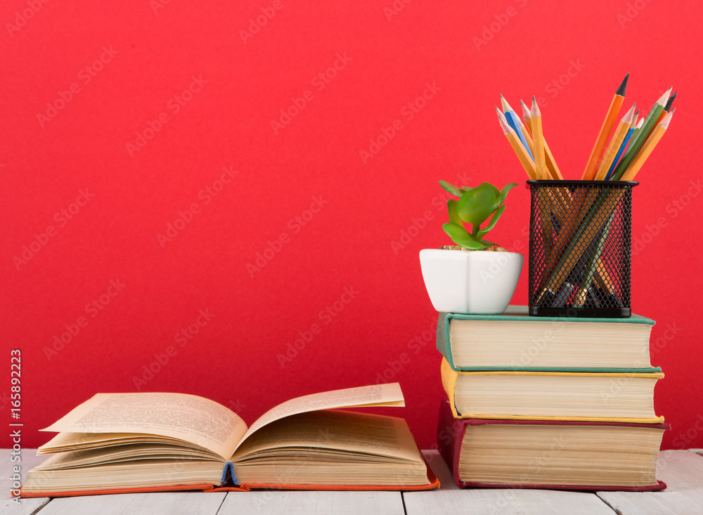 education and wisdom concept - open book on wooden table, color background education and wisdom concept - open book on wooden table, color background