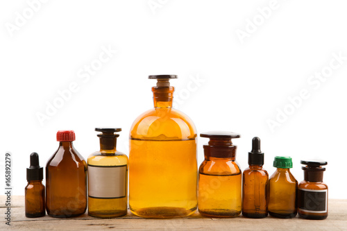 Different vintage pharmacy bottles isolated on white