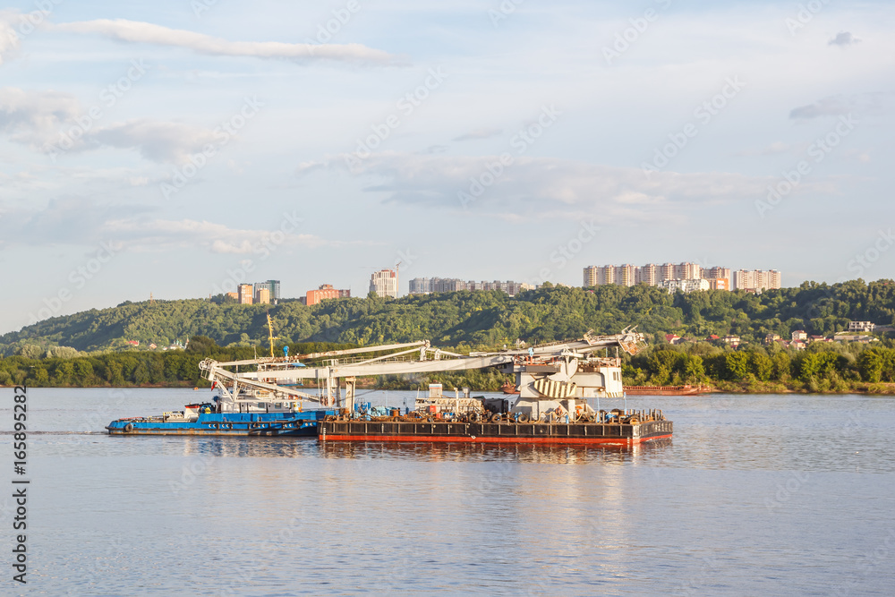 Floating crane against the background of the city of Nizhny Novgorod