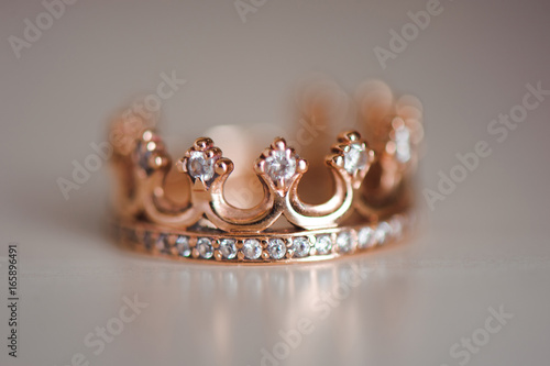 Crown ring with precious stones
