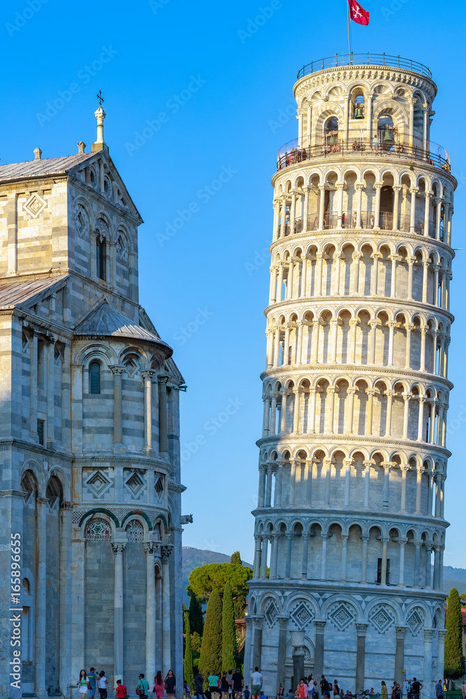 Sunlight hit on the top of the Leaning Tower and Pisa Cathedral in Italy