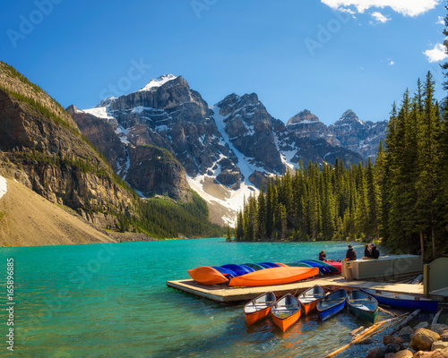 Canoes on a jetty at Moraine lake in Banff National Park, Canada
