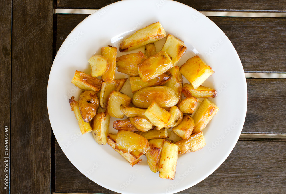 Plate of homemade potato chips from top view Plate of homemade potato chips from top view