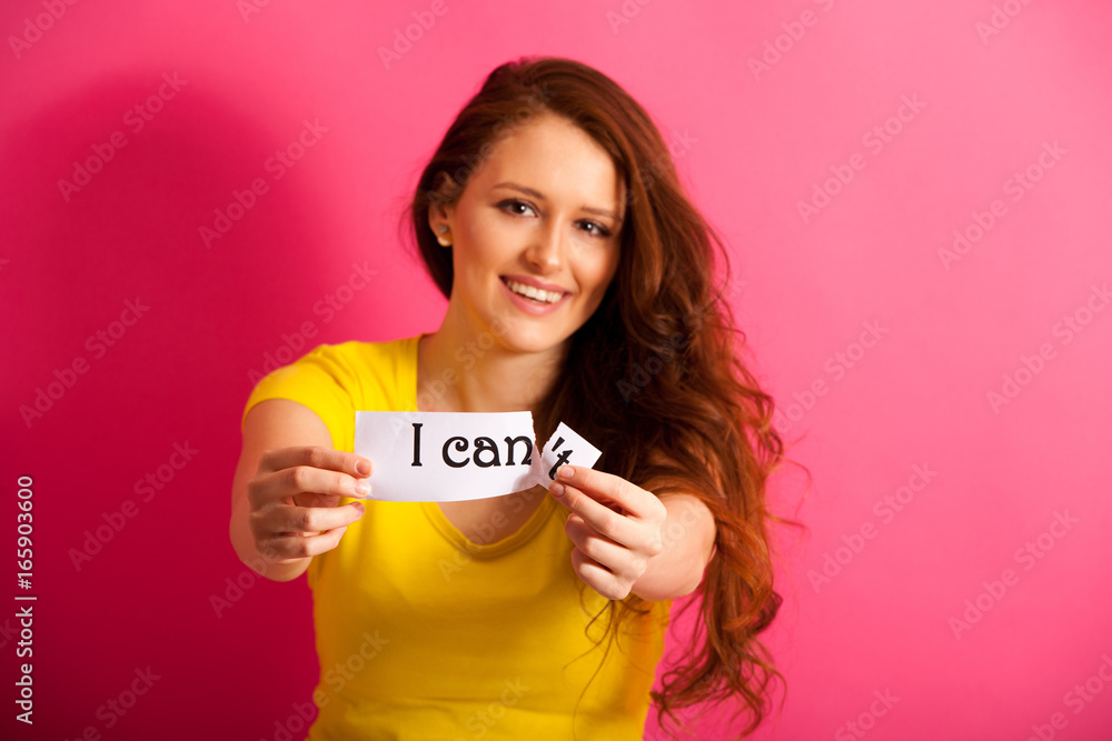 beautiful Woman tearing apart can't text over vibrant pink background beautiful Woman tearing apart can't text over vibrant pink background