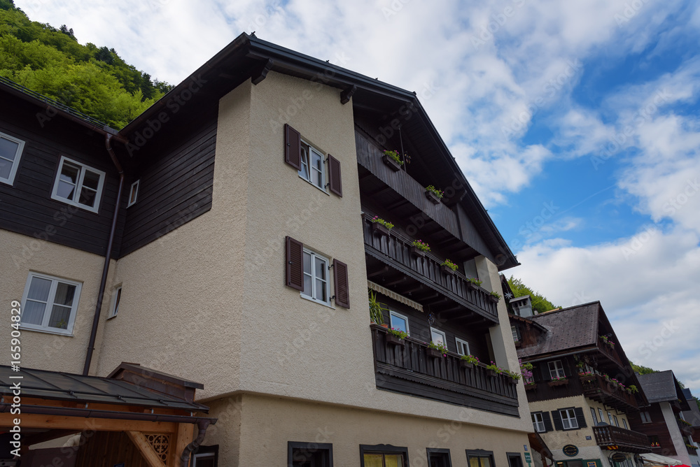 Typical Austrian Alpine houses with bright flowers, Hallstatt, Austria, Europe