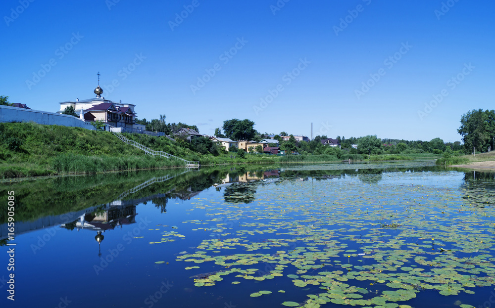 Rural landscape with riverside temple
