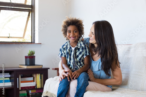 Adopted child playing with mother