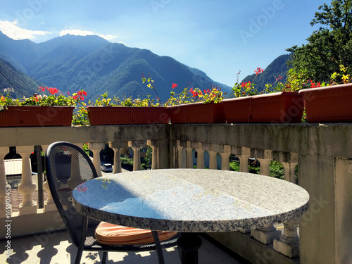 Table and chair at the balcony veranda in Aurigeno photo