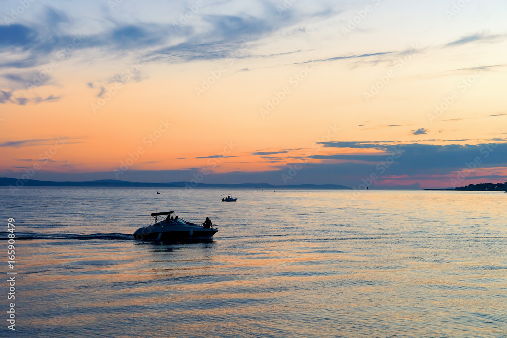 Naklejka premium Boats at harbor Adriatic Sea Omis Croatia at sunset