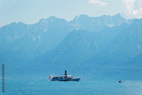 Water ferry ship with Swiss flag at Lake Geneva Lausanne