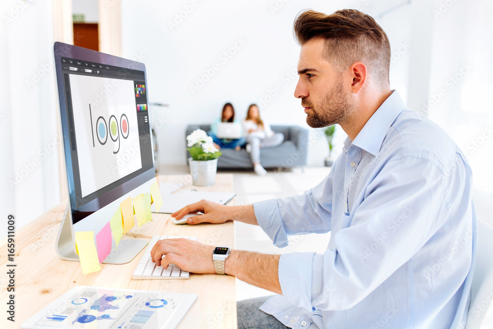 Hipster man designing a logo Hipster man designing a logo