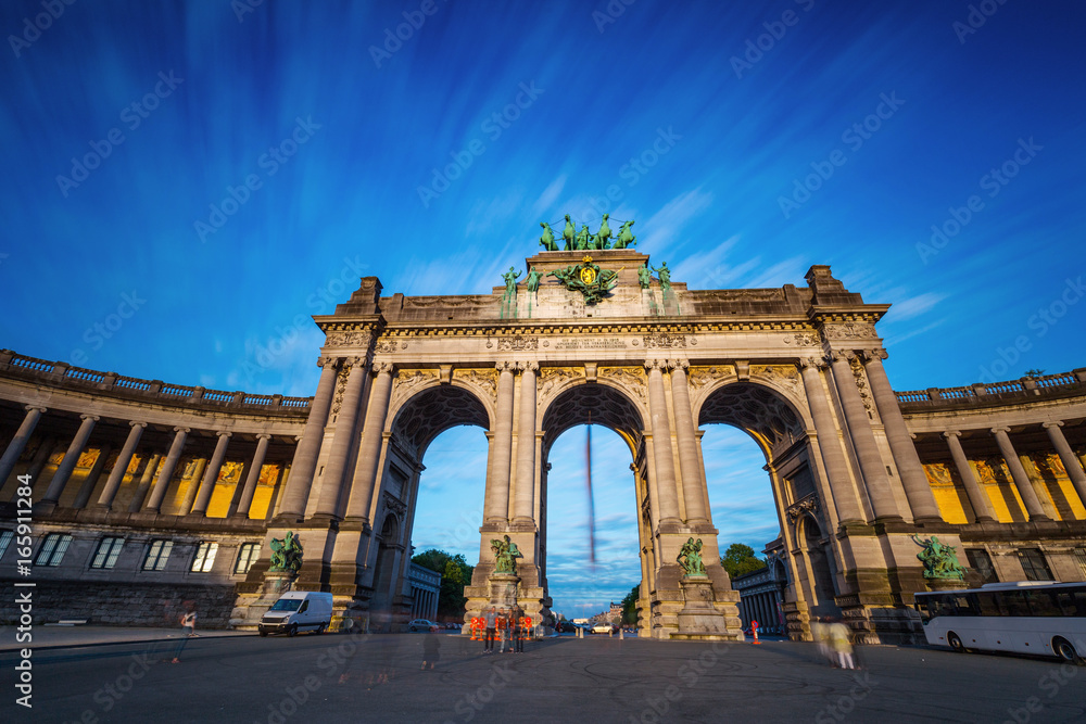 Dramatic view of the Triumphal Arch in Park Cinquantenaire in Brussels during sunset