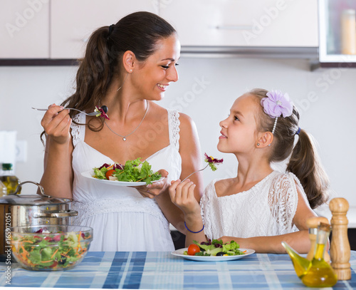 Family of two having healthy lunch with veggies