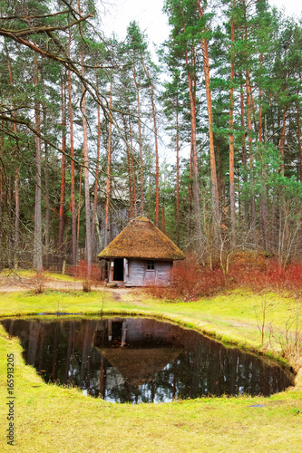 Old house with artificial pond at Ethnographic village Riga Baltic