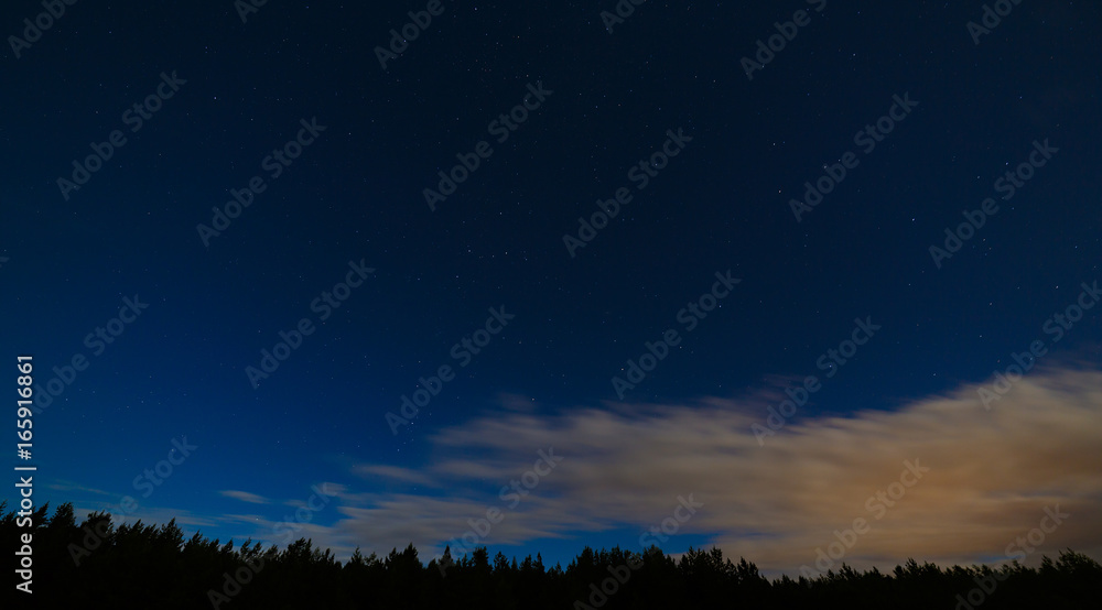 Night landscape with a full moon. Starry sky with clouds. Night landscape with a full moon. Starry sky with clouds.