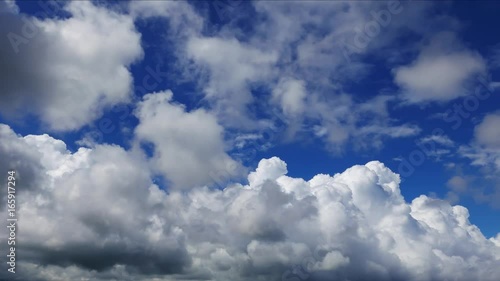 A long time lapse video showing parallax motion and transformation of clouds in great depth. Taken around noon time. photo