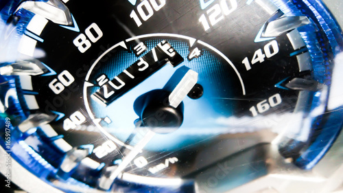 Close up shot of a speed meter in a car