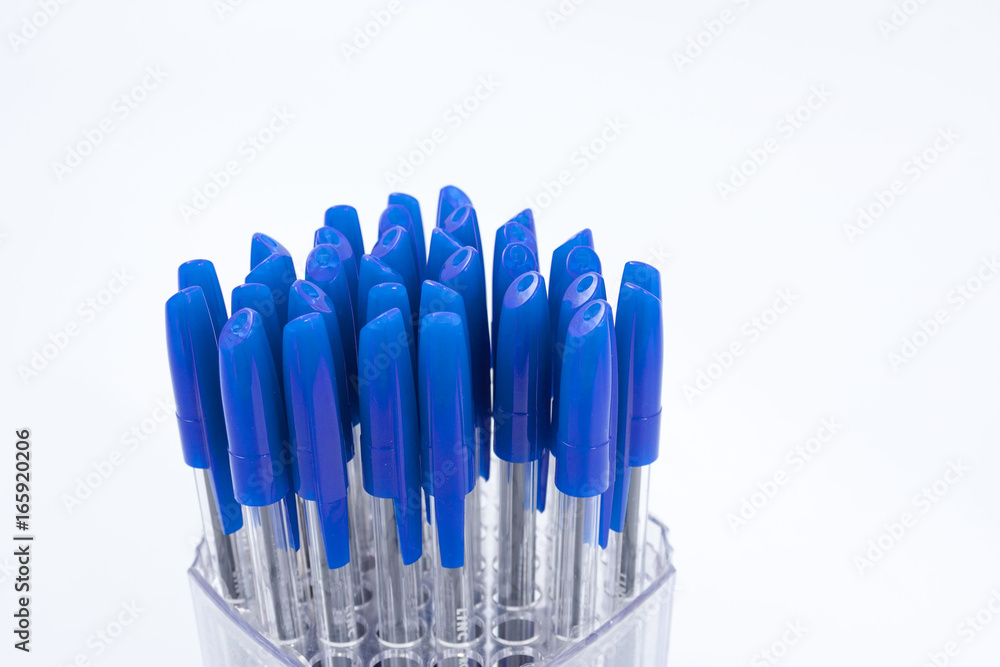 A lot of ballpoint pens on a white background.