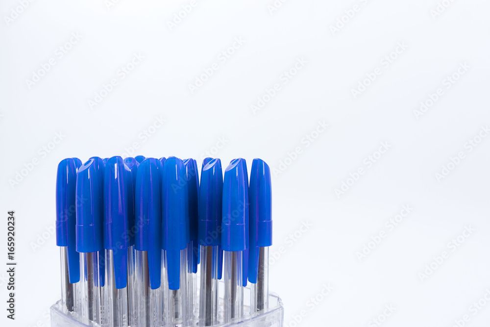 A lot of ballpoint pens on a white background. A lot of ballpoint pens on a white background.