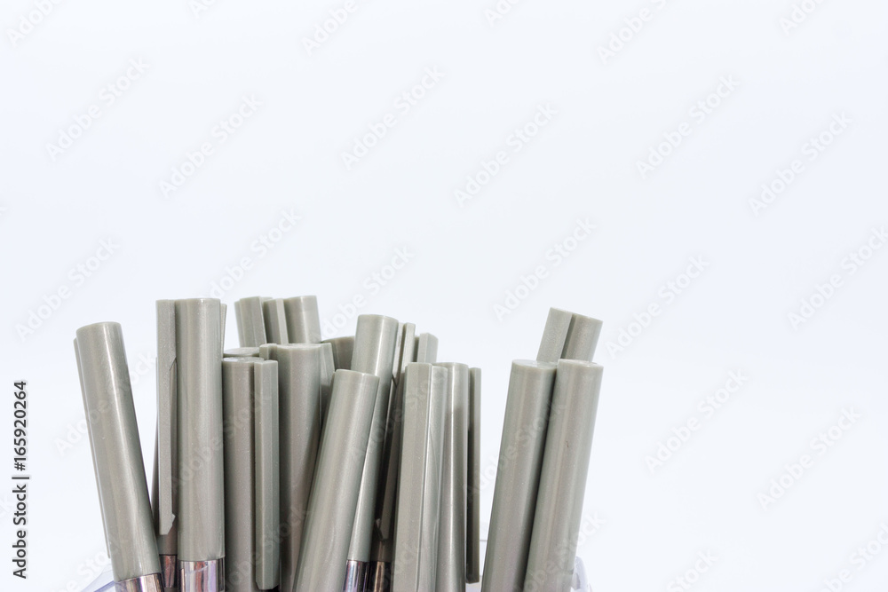 Fototapeta premium A lot of ballpoint pens on a white background.
