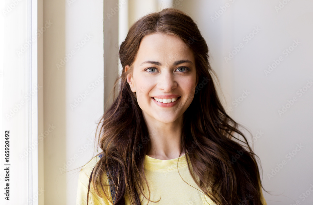 portrait of smiling young woman or teenage girl portrait of smiling young woman or teenage girl