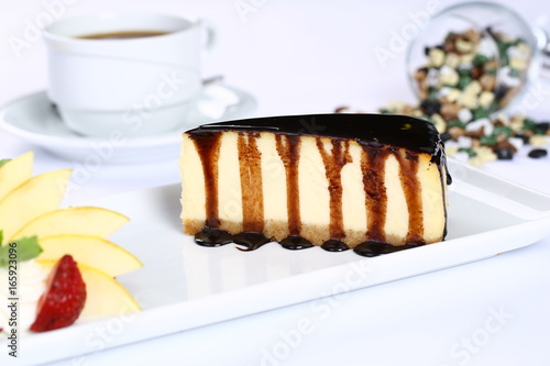 Slice of chocolate cheesecake and coffee