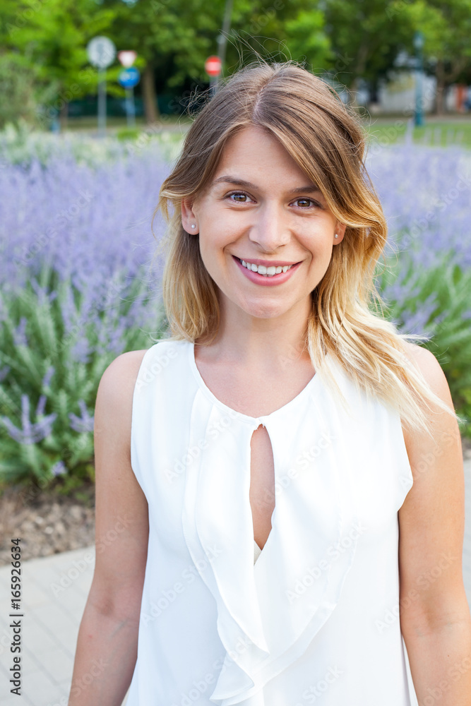 Smiling woman in front of blooming lavender Smiling woman in front of blooming lavender