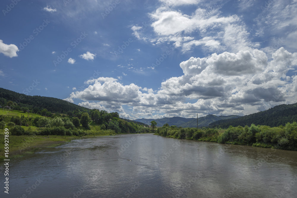 summer day landscape river, mountains, cloudy sky