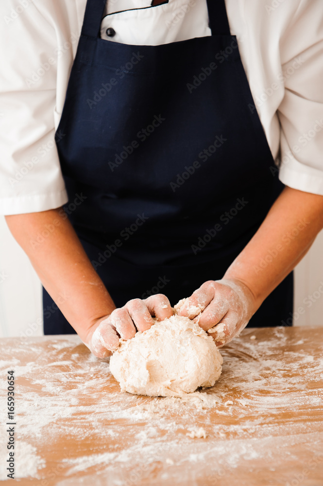 Chef preparing dough - cooking process Chef preparing dough - cooking process