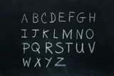 Alphabet letters written in chalk