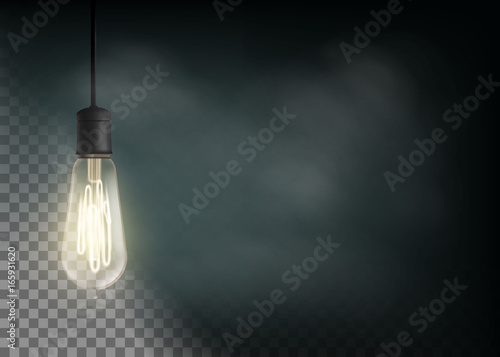 Vintage light bulb is glowing in the dark.