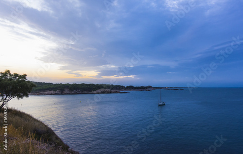 Blue sunset in Rosas bay, Costa Brava, Spain. © tanaonte