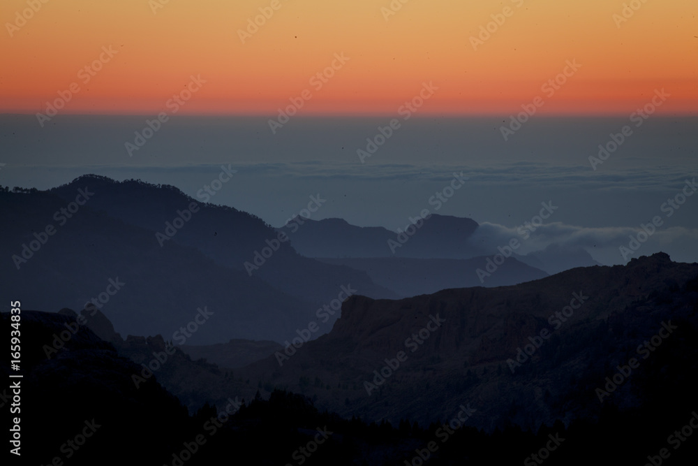 Beautiful sunset in the mountains. Canary Islands. The top of Terenif