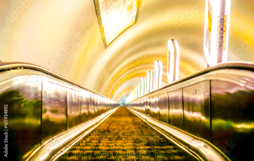 high escalators of the subway in big city