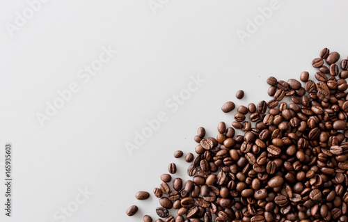 coffee bean on table with soft-focus and over light in the background. top view