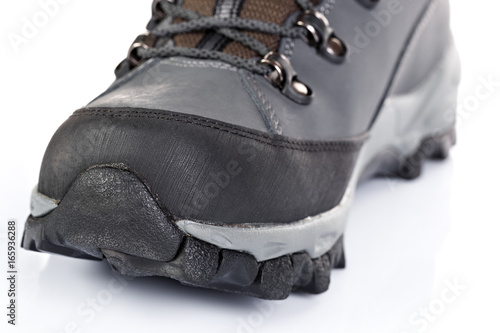 Tourist boots for mountain hikes with reinforced soles and membrane material.