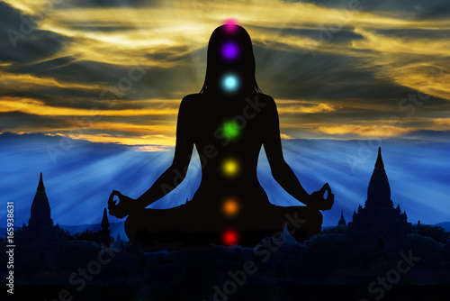Silhouette of woman with seven chakra points