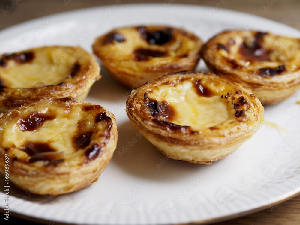 Custard tarts in a plate with some softfocus