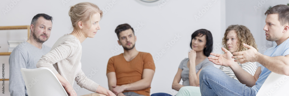 Man talking during psychotherapy Man talking during psychotherapy