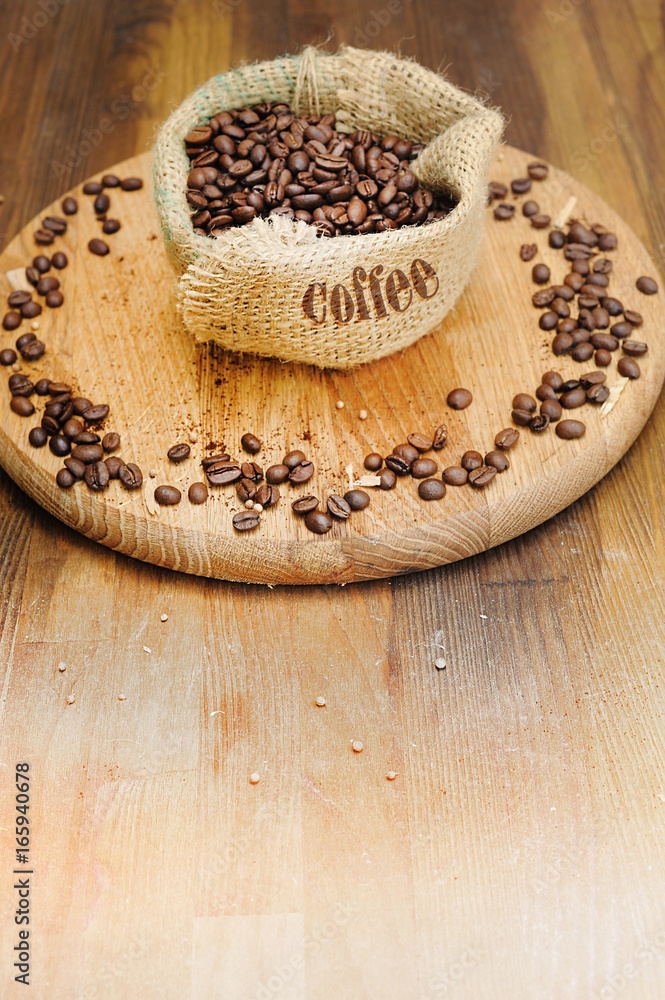 Coffee beans and sack bag on old background Coffee beans and sack bag on old background