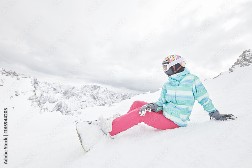 Young sitting woman with snowboard Young sitting woman with snowboard