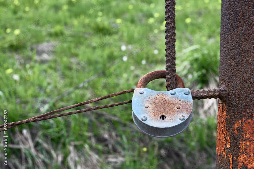 Old rusty padlock on a background of grass Old rusty padlock on a background of grass