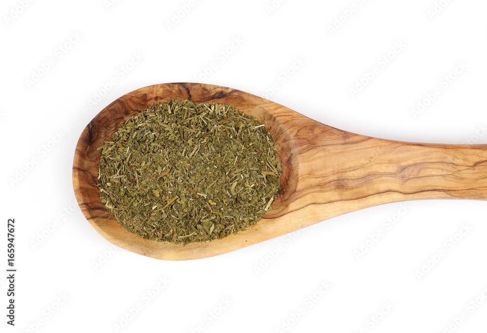 Pile of chopped parsley in wooden spoon isolated on white background, top view Pile of chopped parsley in wooden spoon isolated on white background, top view