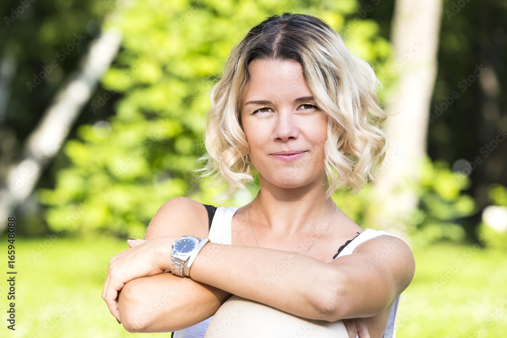 Portrait of a girl in a summer park outdoors 